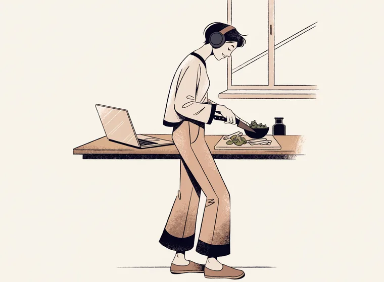 Person cooking while wearing headphones